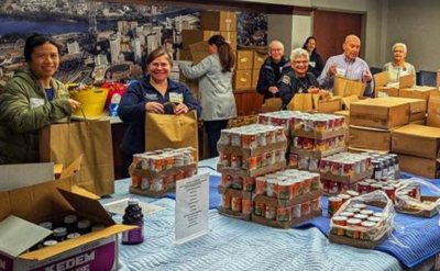 Schoke Passover distribution 2026_web image Volunteers pack Passover staples for distribution in 2026.